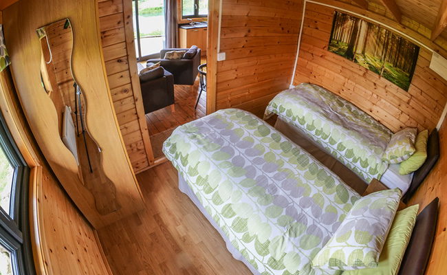 Twin room in Original log cabin at lakeside accommodation